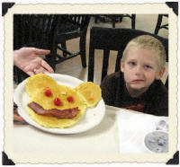 Andrew when he was served his Mickey Mouse pancake.